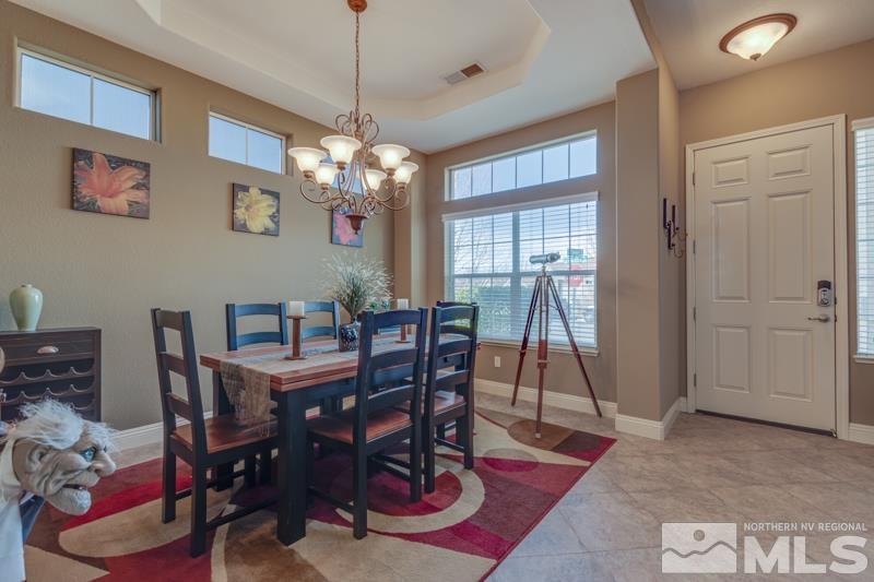 1696 Ghettis Way Reno, NV 89521 - Photo 5 of 25 a view of a dining room with furniture window and wooden floor