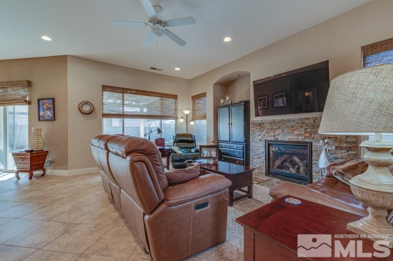 1696 Ghettis Way Reno, NV 89521 - Photo 7 of 25 a living room with furniture and a fireplace