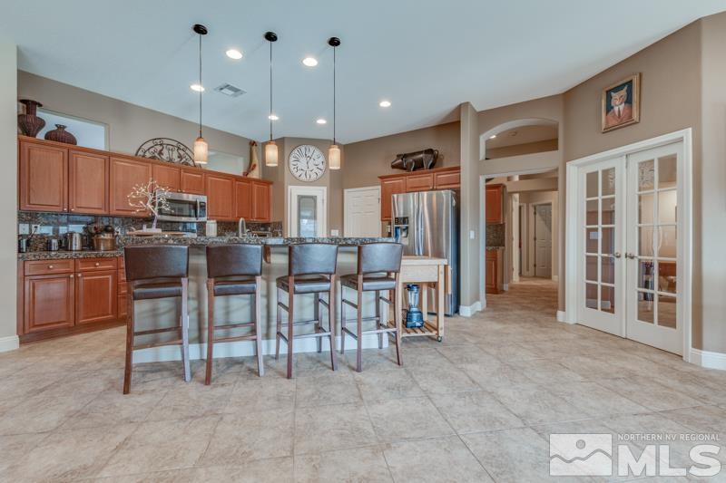 1696 Ghettis Way Reno, NV 89521 - Photo 9 of 25 a view of a dining area with furniture