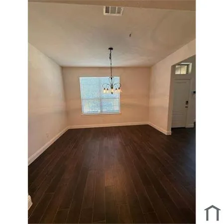 a view of a big room with carpet in it