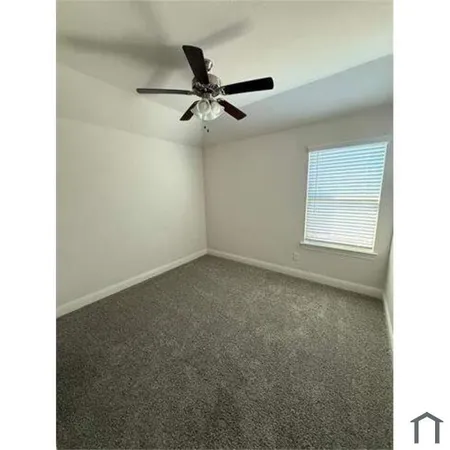 a view of a big room with carpet