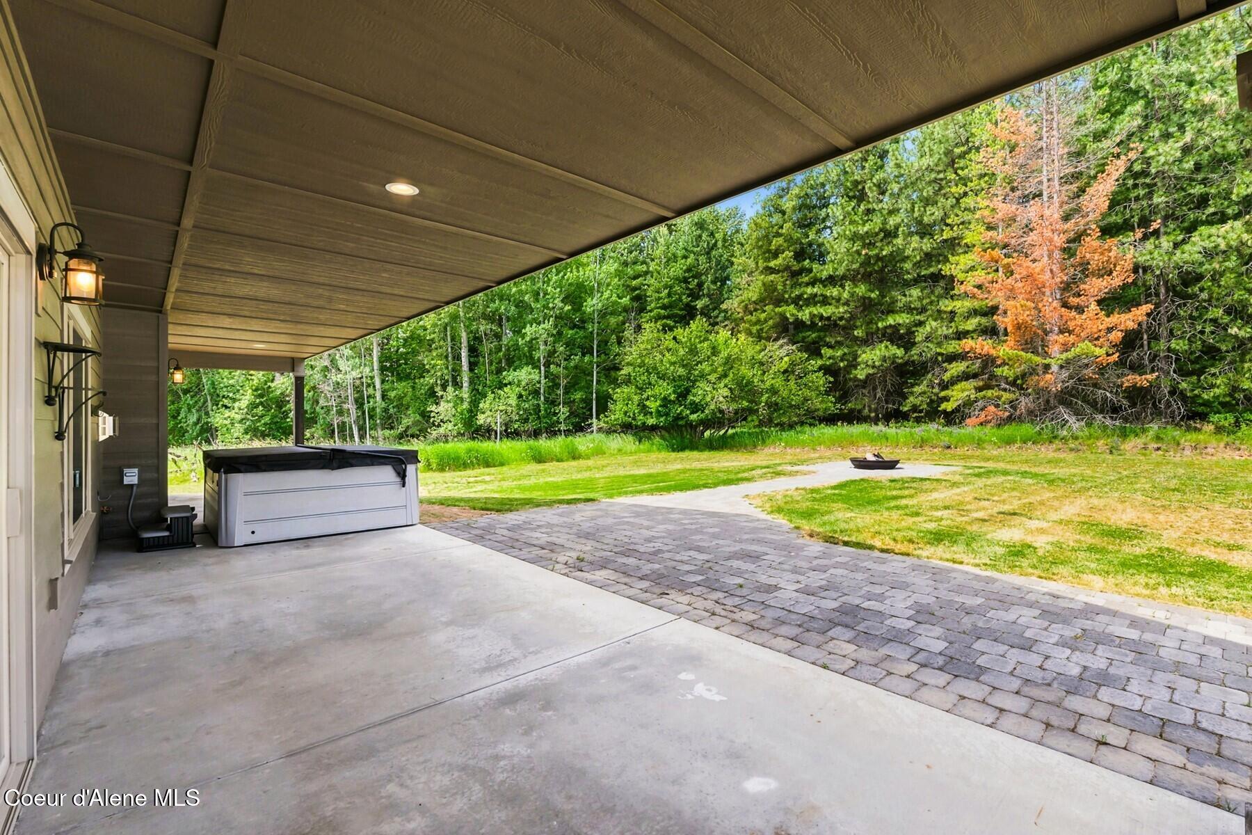 1317 Prominence Court Sandpoint, ID 83864 - Photo 41 of 44 Covered Patio Living Area Access