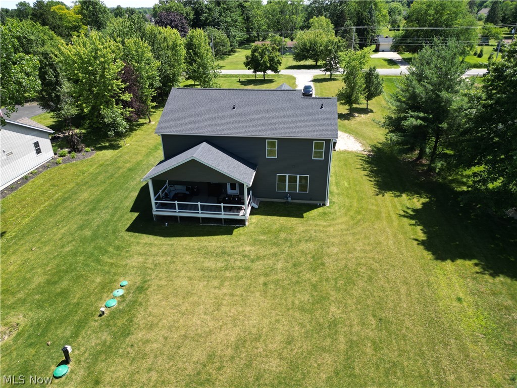 4553 Sharon Copley Road Medina, OH 44256 - Photo 26 of 32 Two-story dark grey residence featuring a covered deck with white railings