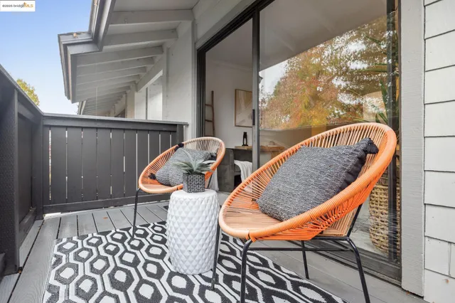 a living room with furniture a rug and a fireplace