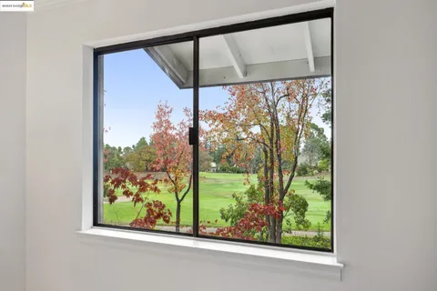 a bedroom with a bed and a television