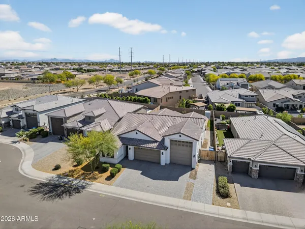 an aerial view of a house with outdoor space