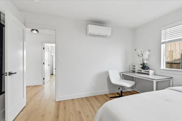 a room that has a bed and a chair in it