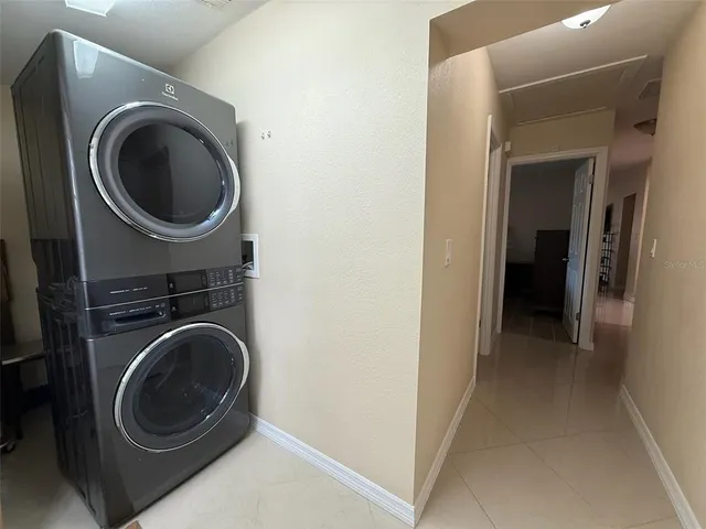 a view of a hallway with washer and dryer