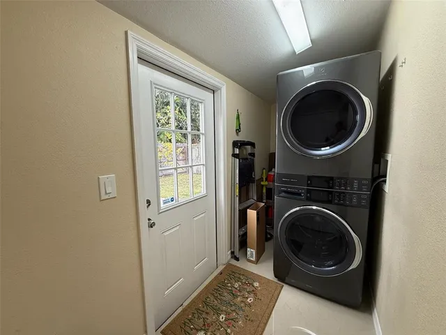 a view of a hallway with washer and dryer
