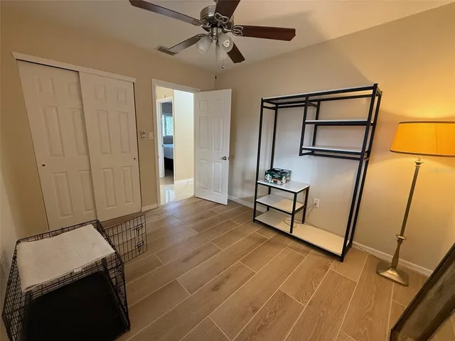 a bedroom with a bed and a dresser