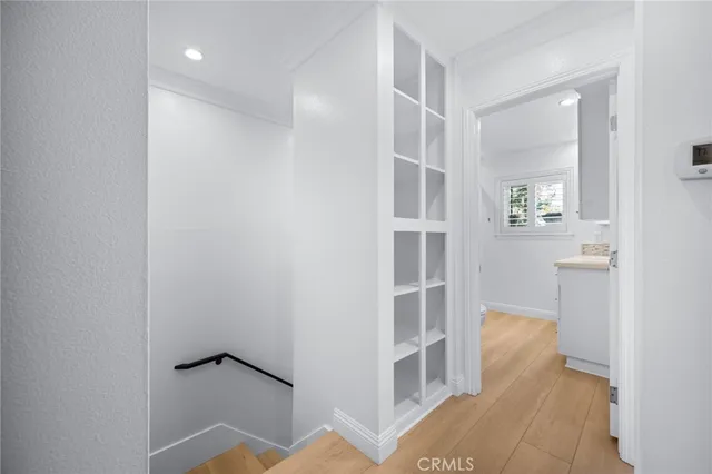 a view of wooden floor and windows in a room