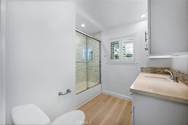 a bathroom with a sink toilet and tub