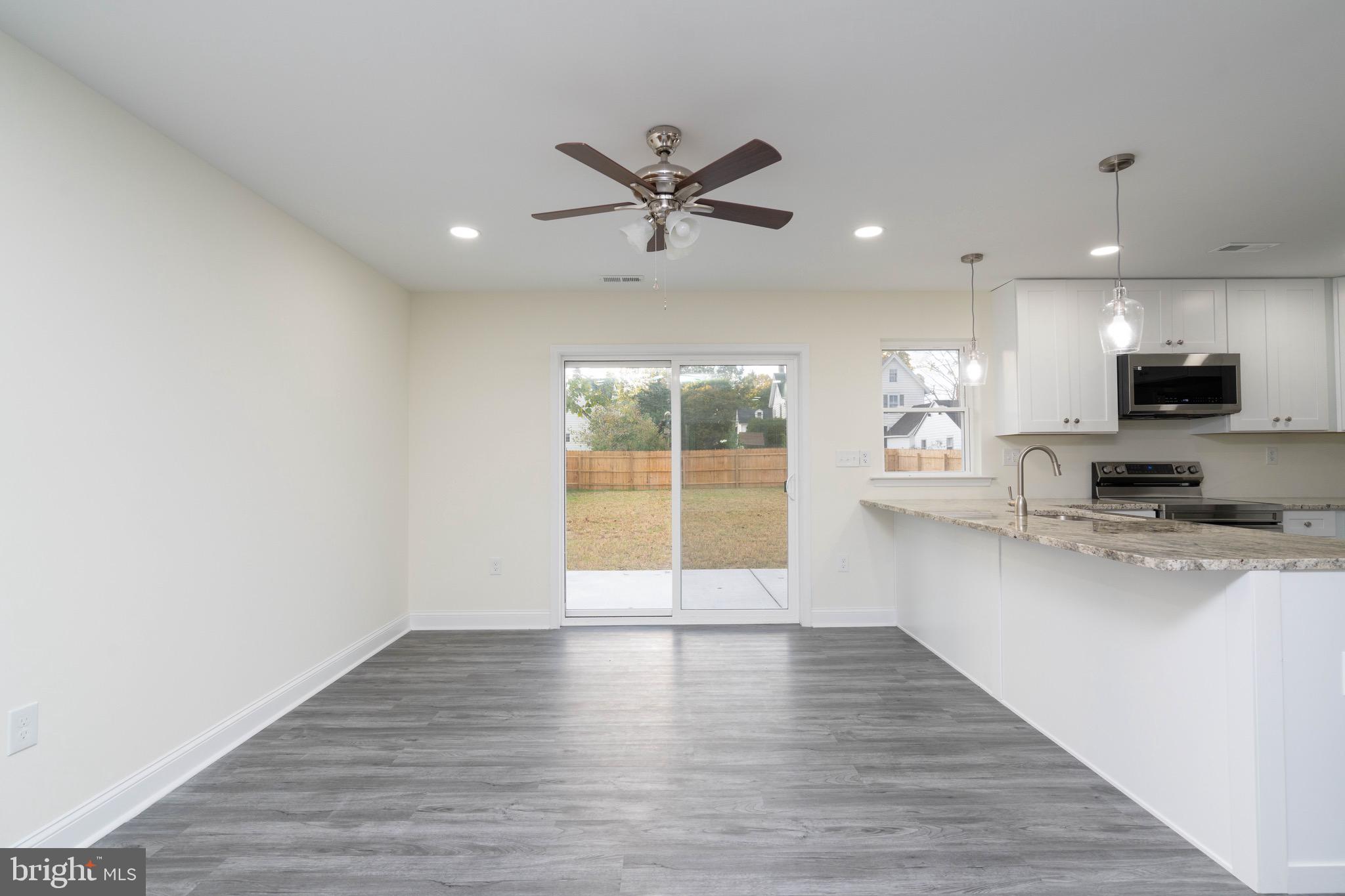 308 Gray Street Townsend, DE 19734 - Photo 11 of 33 a view of a kitchen with a sink and a window