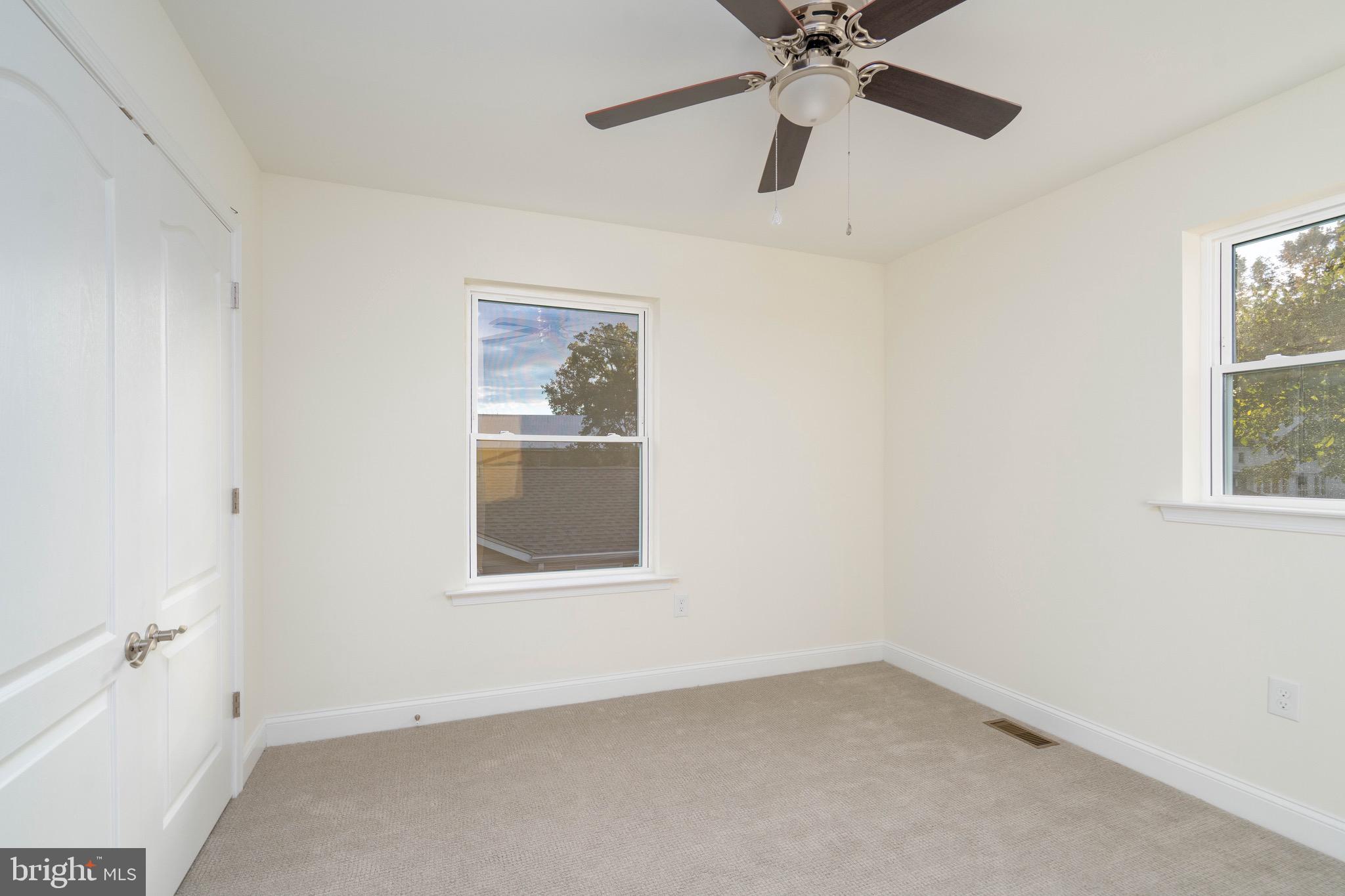 308 Gray Street Townsend, DE 19734 - Photo 16 of 33 an empty room with a window and a fan