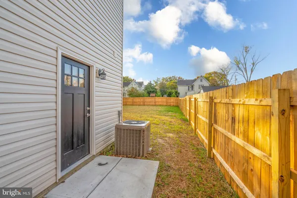 a view of a backyard of the house