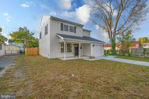 a house with trees in front of it
