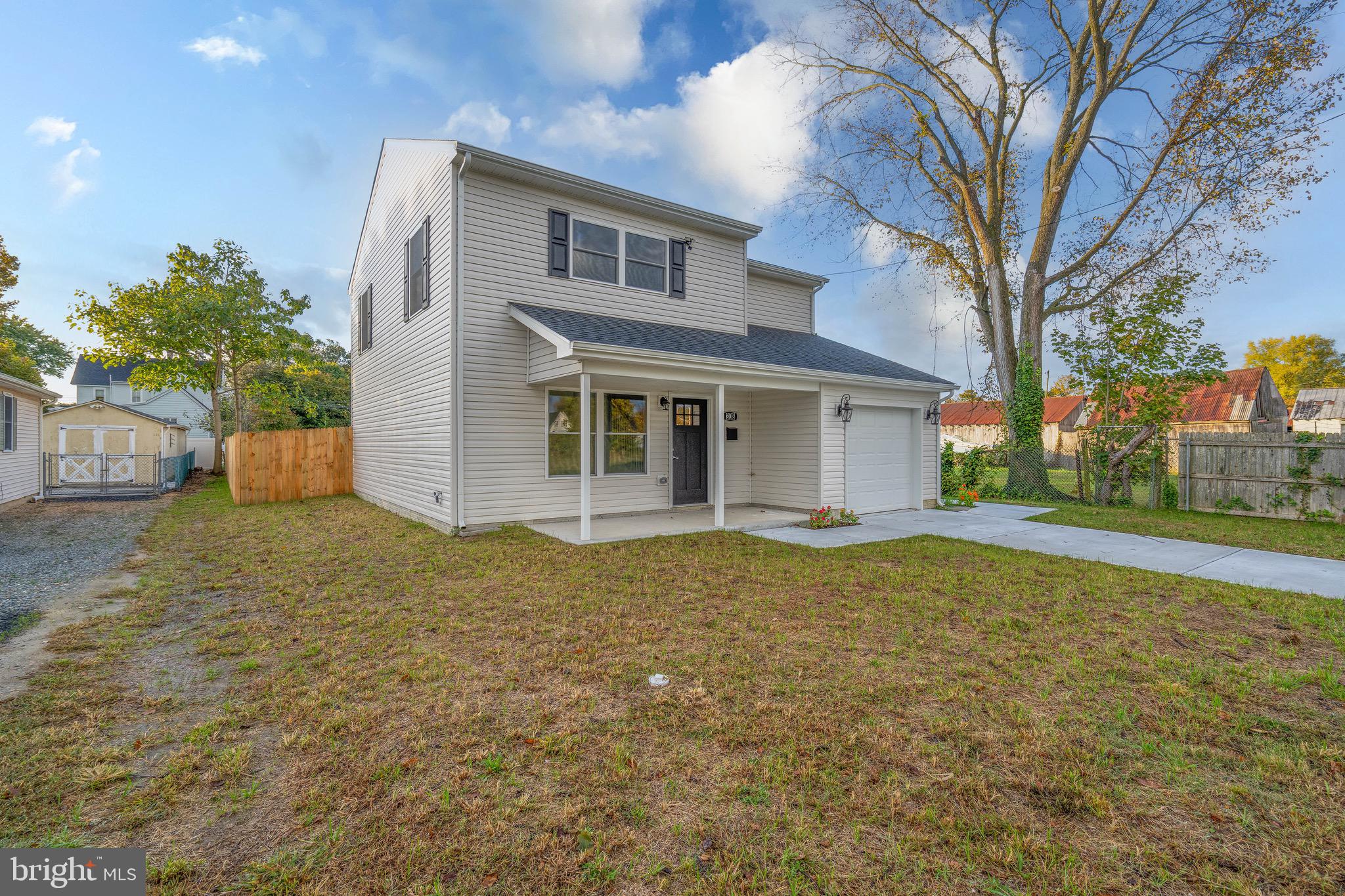 308 Gray Street Townsend, DE 19734 - Photo 3 of 33 a house with trees in front of it