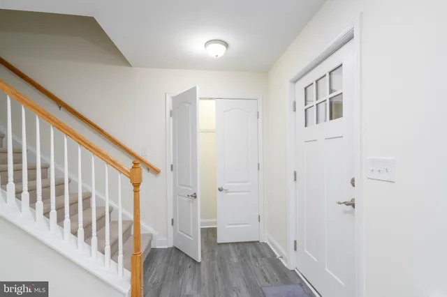 a view of an entryway with wooden floor