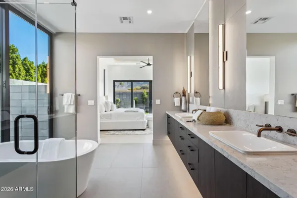 a kitchen with stainless steel appliances a sink and cabinets