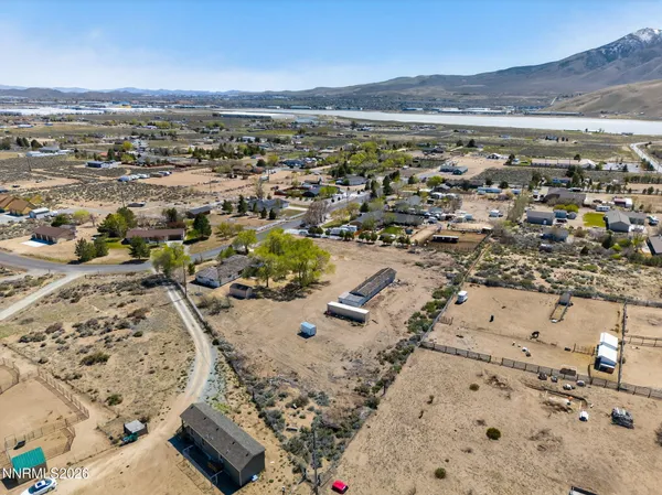 an aerial view of a house with a yard
