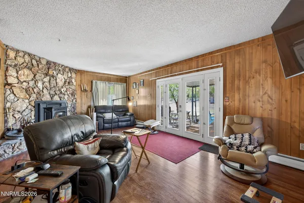 a living room with furniture or couch and a wooden floor