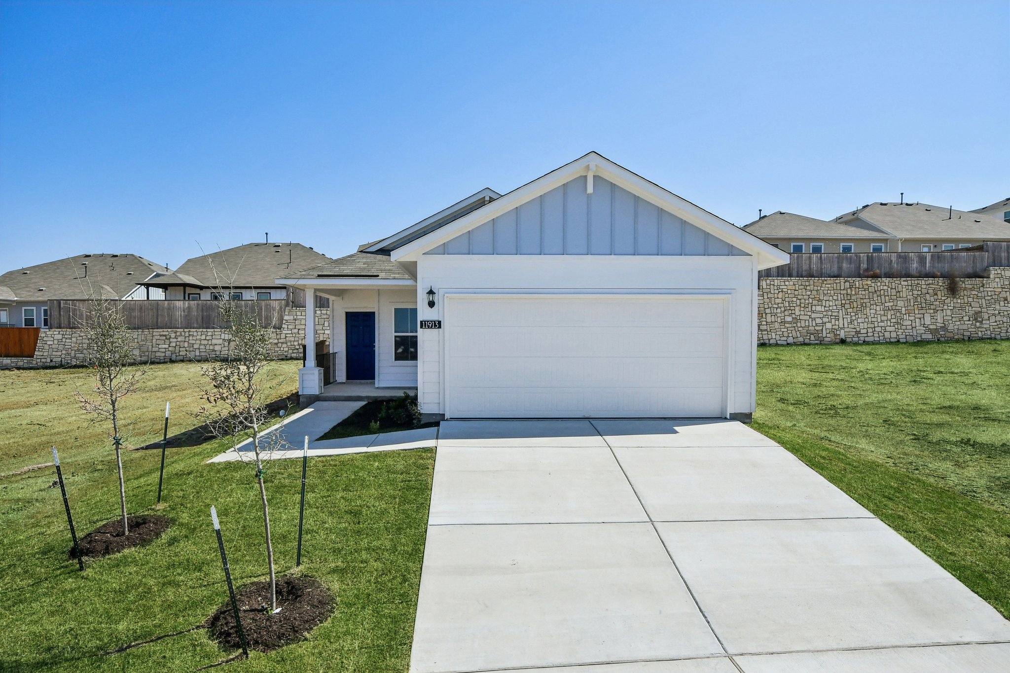 11913 Ellena Cove Austin, TX 78747 - Photo 1 of 35 a front view of a house with a yard