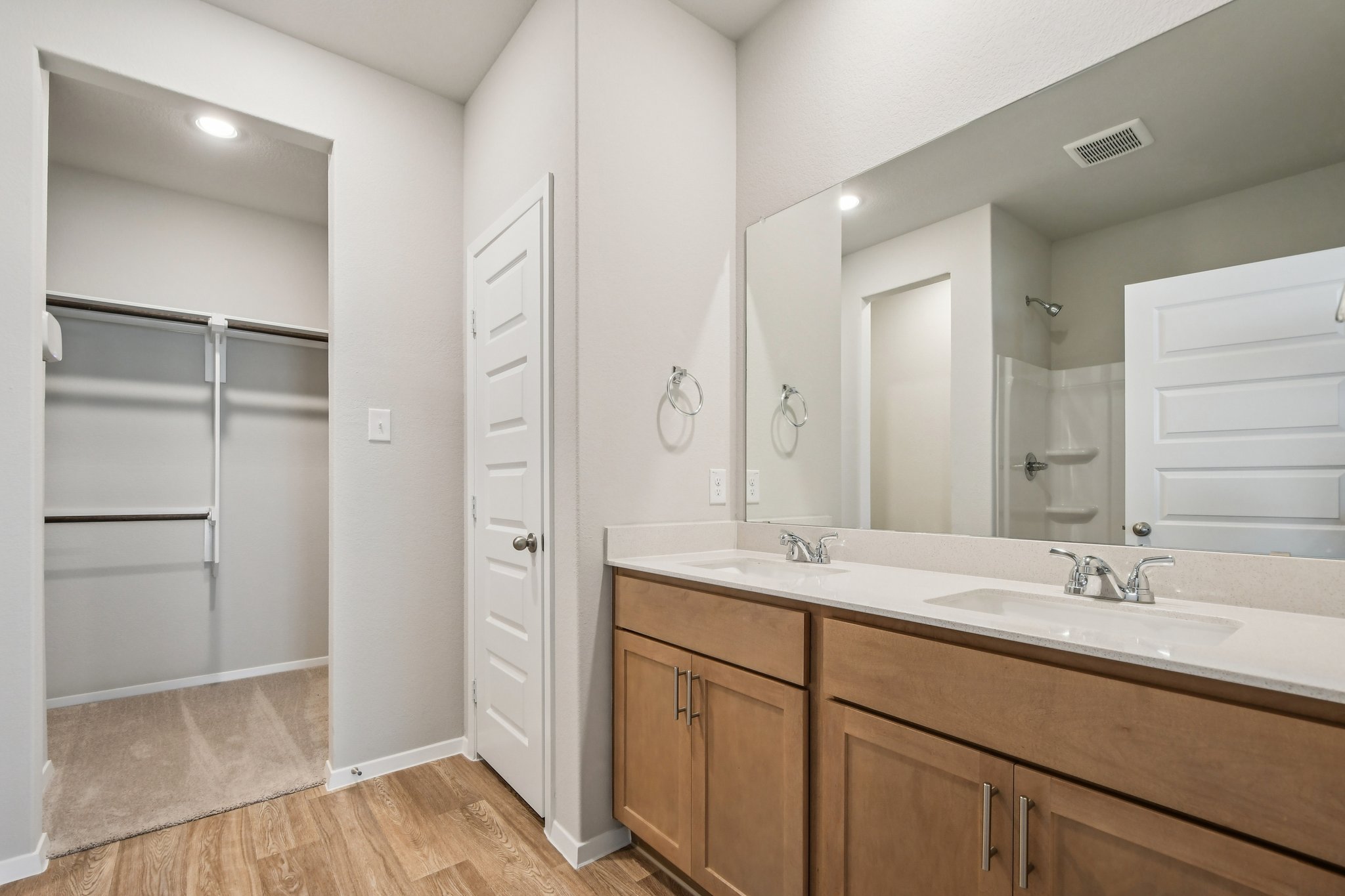 11913 Ellena Cove Austin, TX 78747 - Photo 17 of 35 a bathroom with a double vanity sink and mirror
