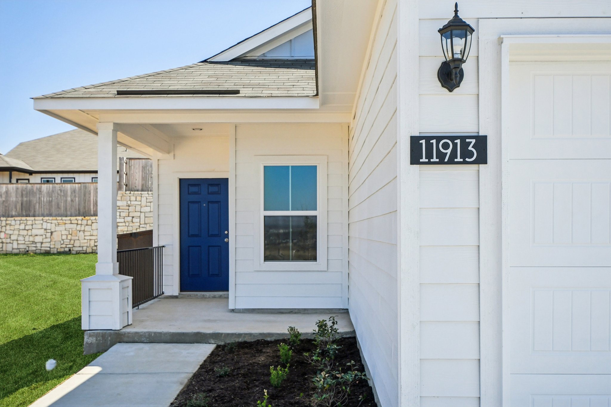 11913 Ellena Cove Austin, TX 78747 - Photo 5 of 35 a front view of a house with garden