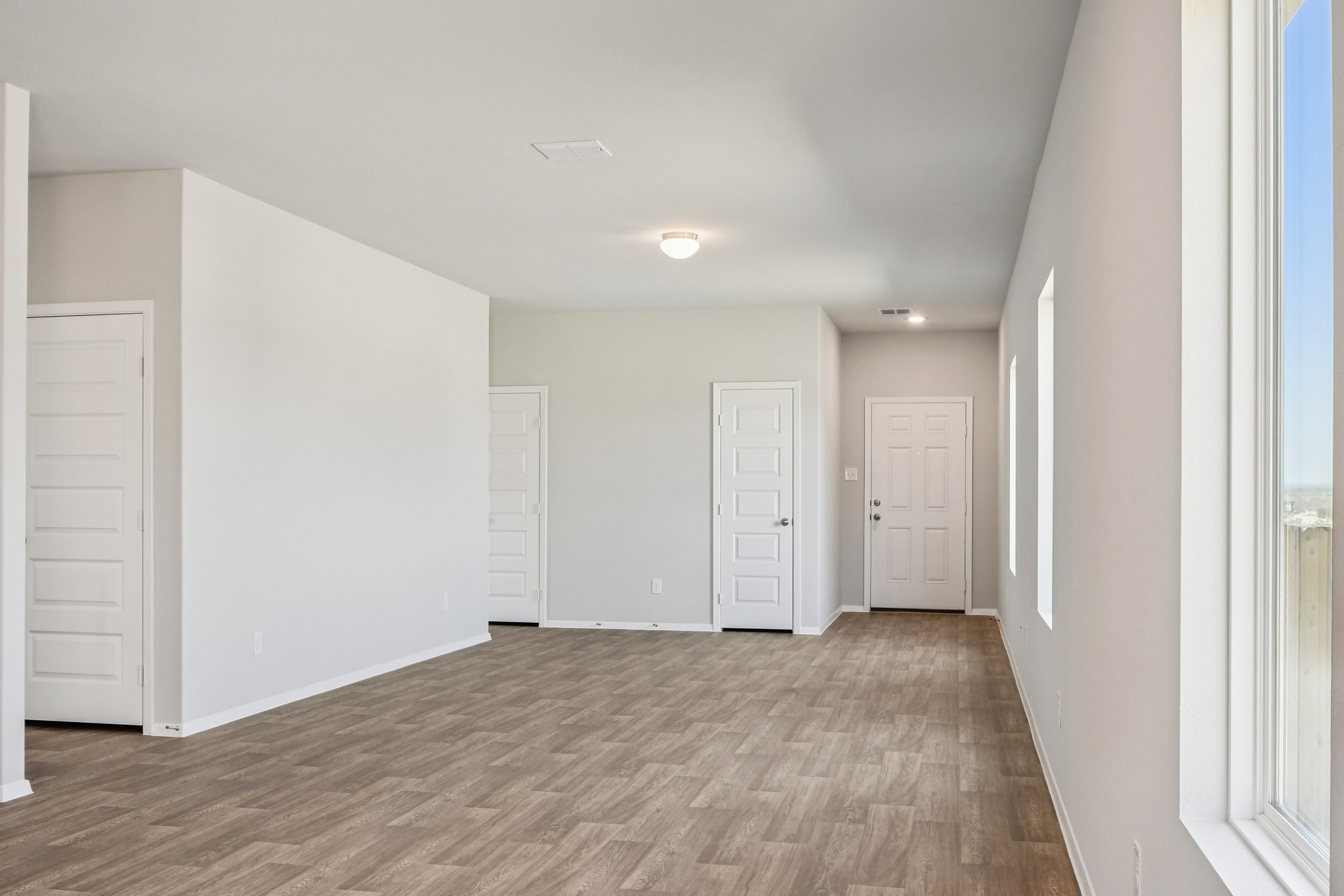 11913 Ellena Cove Austin, TX 78747 - Photo 10 of 35 a view of hallway with wooden floor