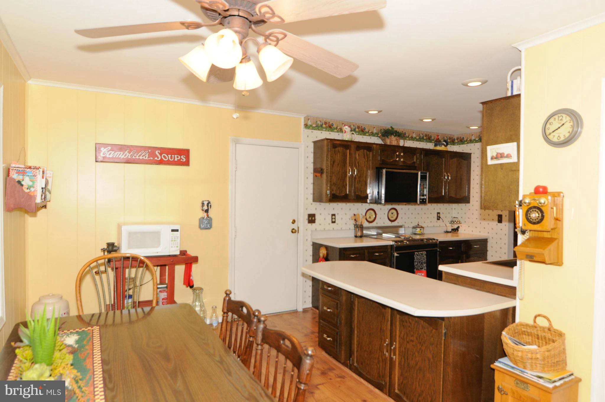 8187 Murphy Road Fulton, MD 20759 - Photo 12 of 25 a dining hall with stainless steel appliances kitchen island granite countertop a stove and a sink