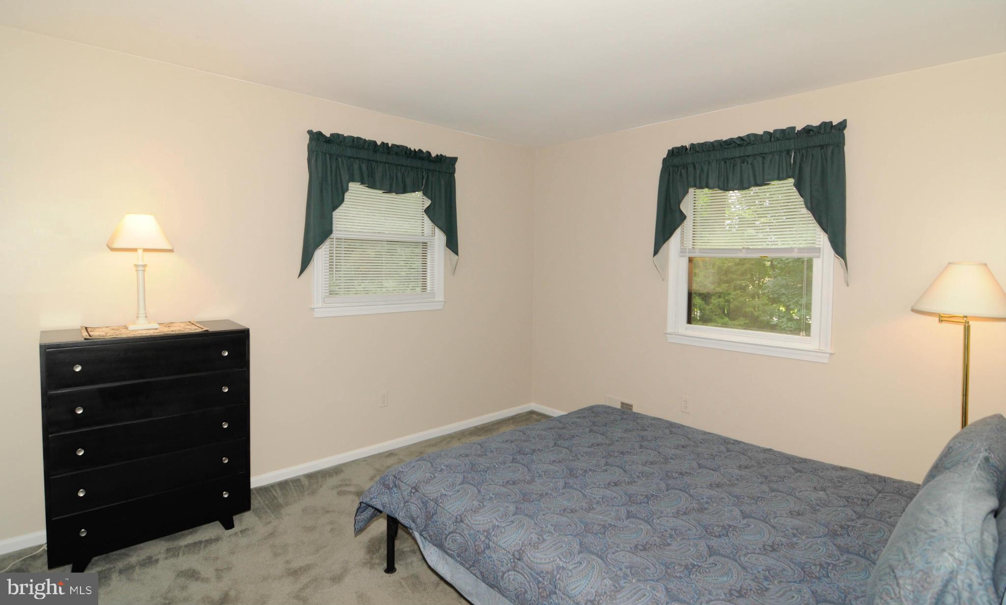 8187 Murphy Road Fulton, MD 20759 - Photo 15 of 25 a bedroom with a bed and a window