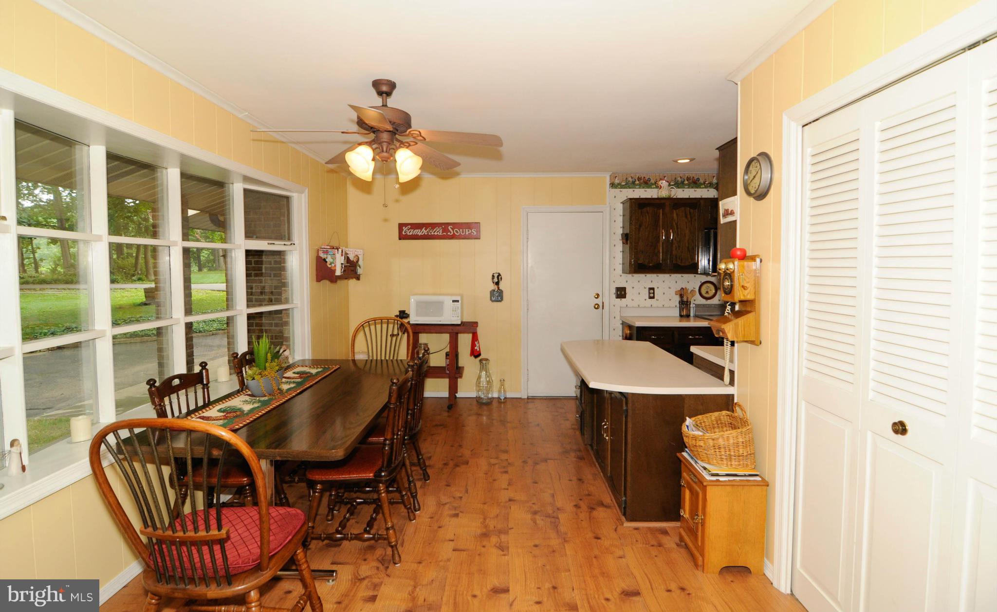 8187 Murphy Road Fulton, MD 20759 - Photo 3 of 25 a view of a dining room with furniture window and outside view