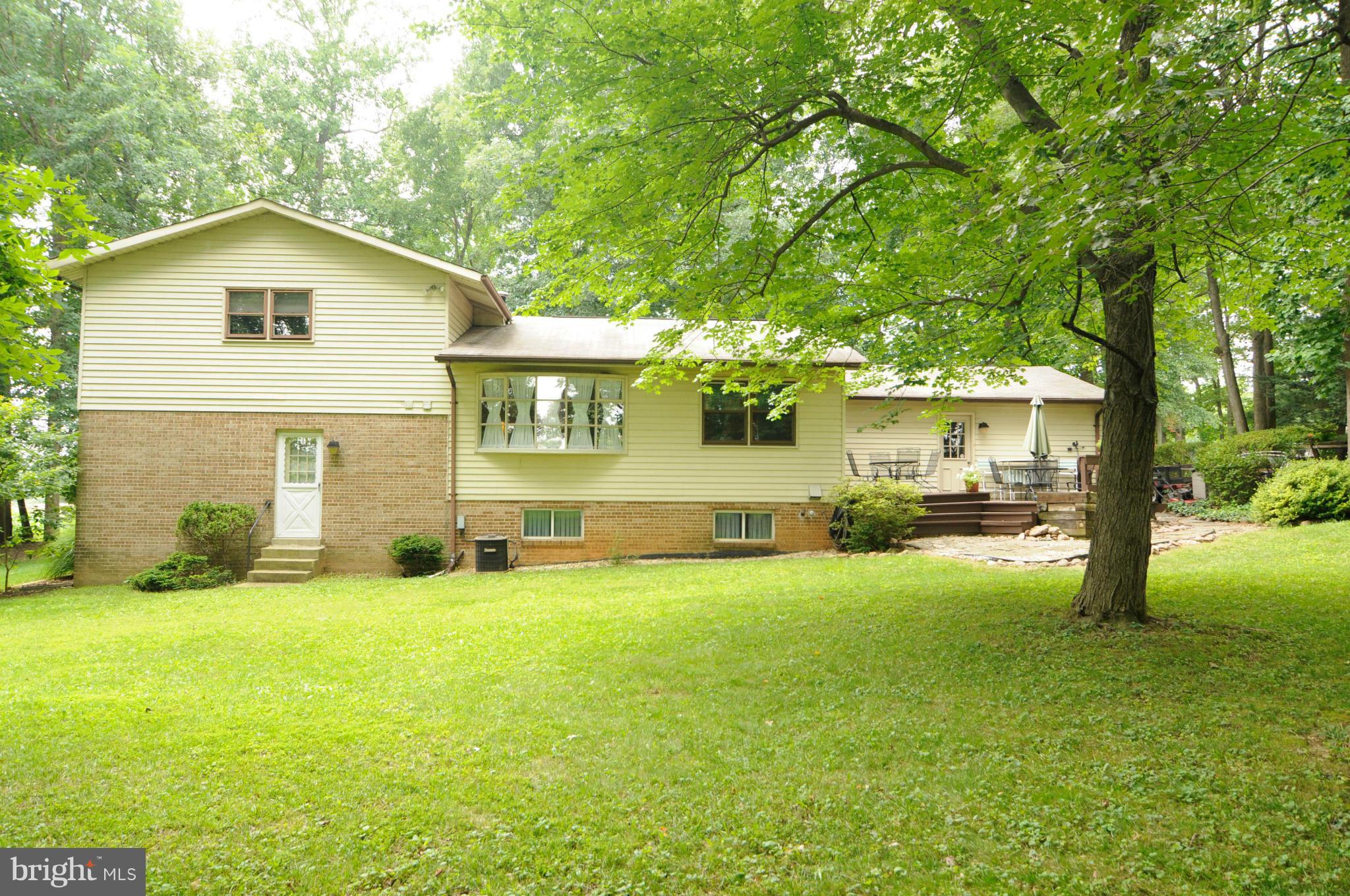 8187 Murphy Road Fulton, MD 20759 - Photo 22 of 25 a view of a house with a yard and sitting area