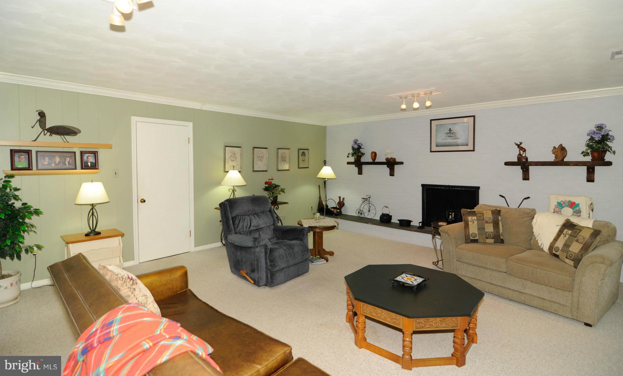 8187 Murphy Road Fulton, MD 20759 - Photo 6 of 25 a living room with furniture and a wooden floor