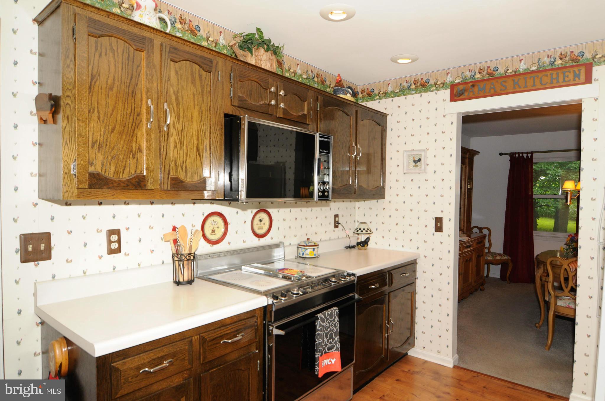 8187 Murphy Road Fulton, MD 20759 - Photo 10 of 25 a view of a kitchen area with furniture and flat screen tv