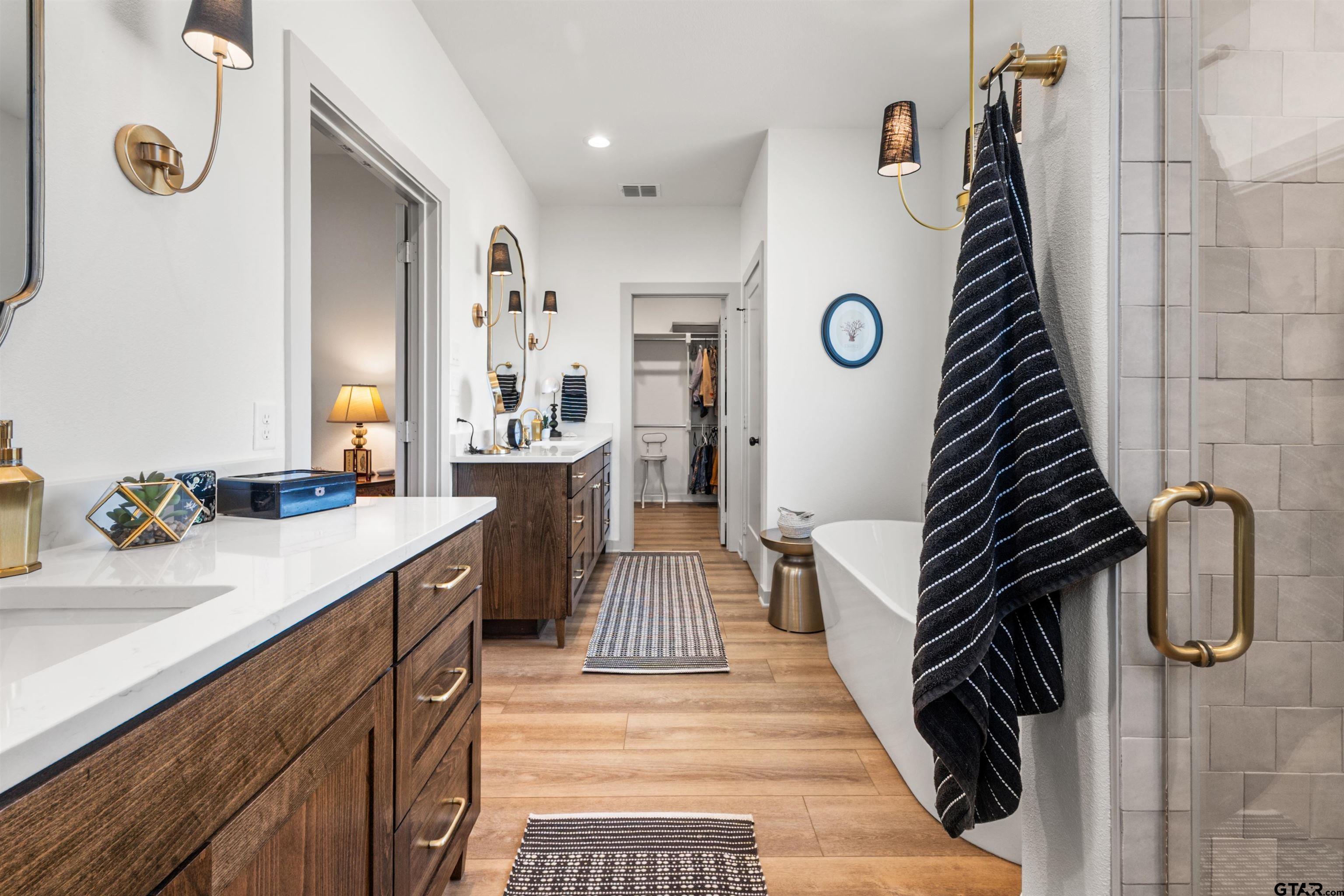 242 Kaul Lane Bullard, TX 75757 - Photo 17 of 45 a bathroom with a sink a mirror and a shower