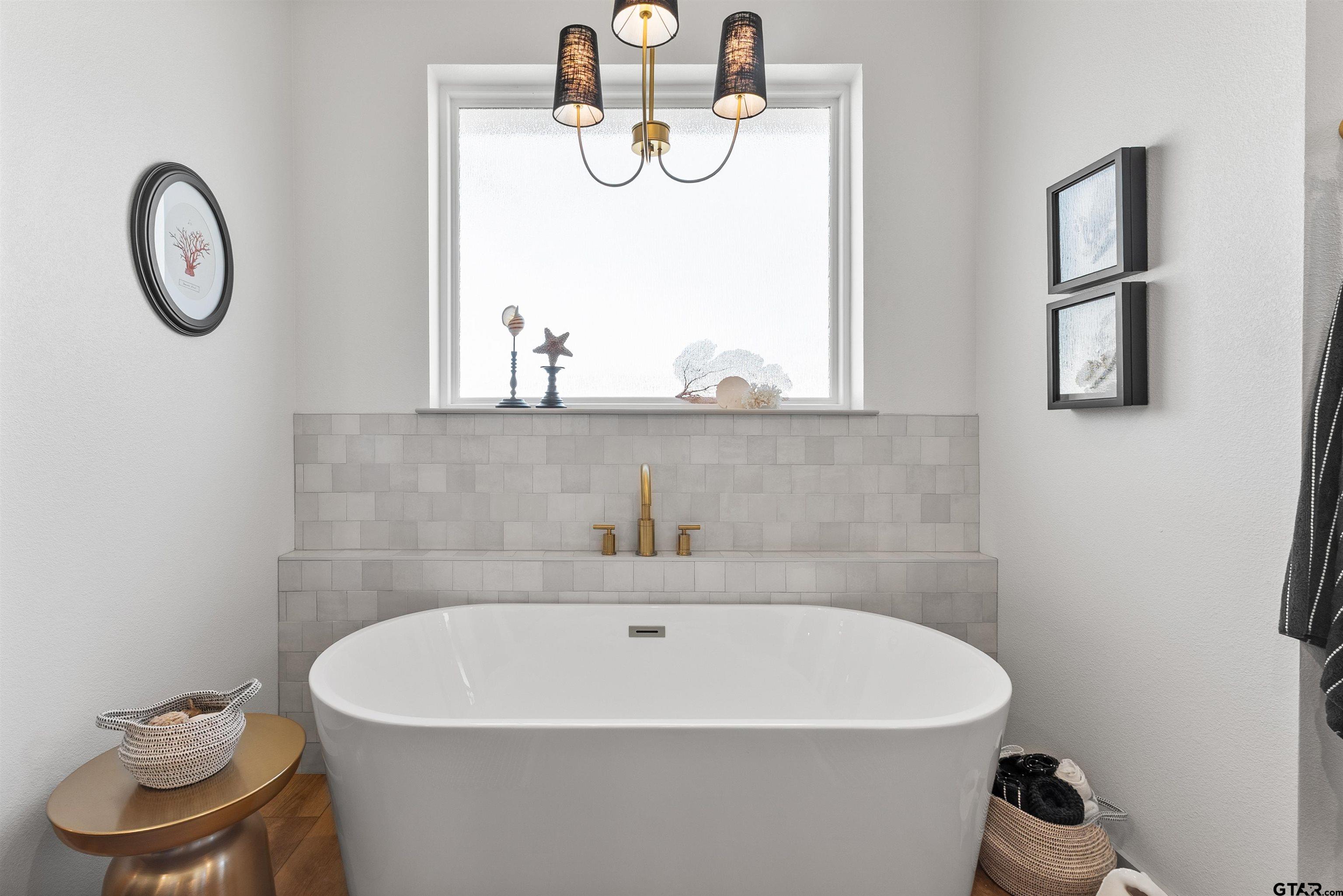 242 Kaul Lane Bullard, TX 75757 - Photo 19 of 45 a white bath tub sitting next to a white sink