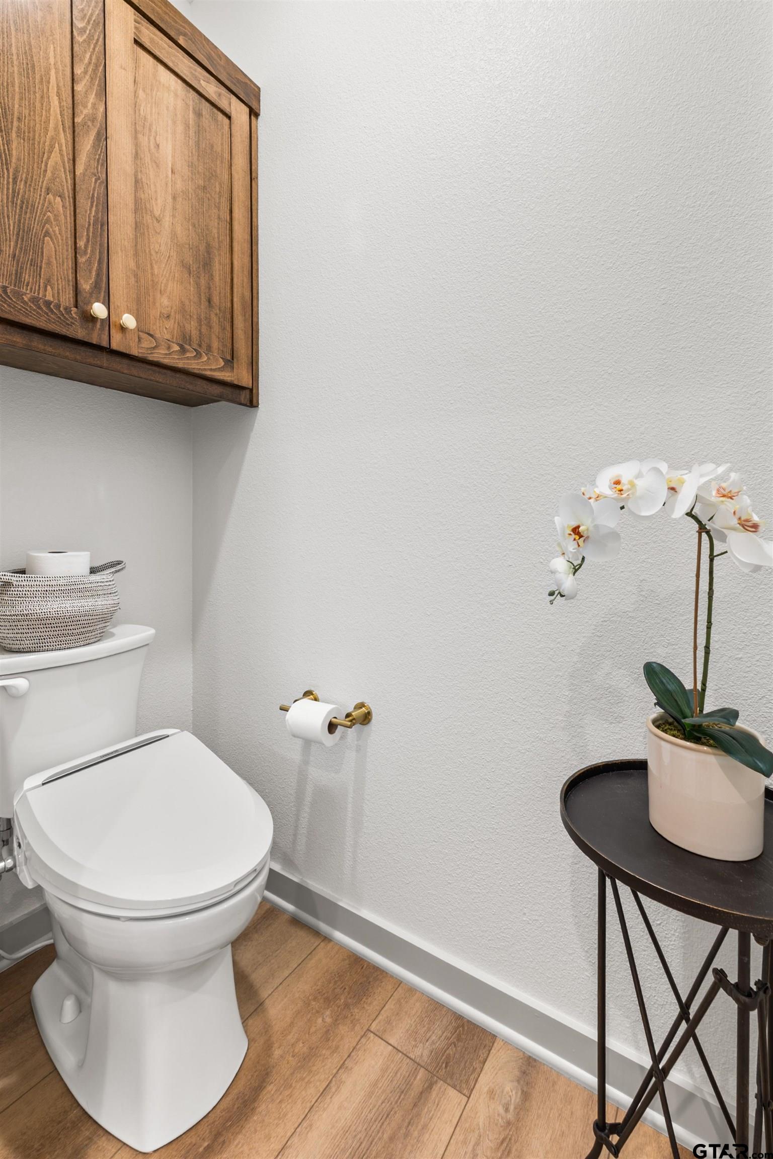 242 Kaul Lane Bullard, TX 75757 - Photo 22 of 45 a bathroom with a toilet a sink and mirror