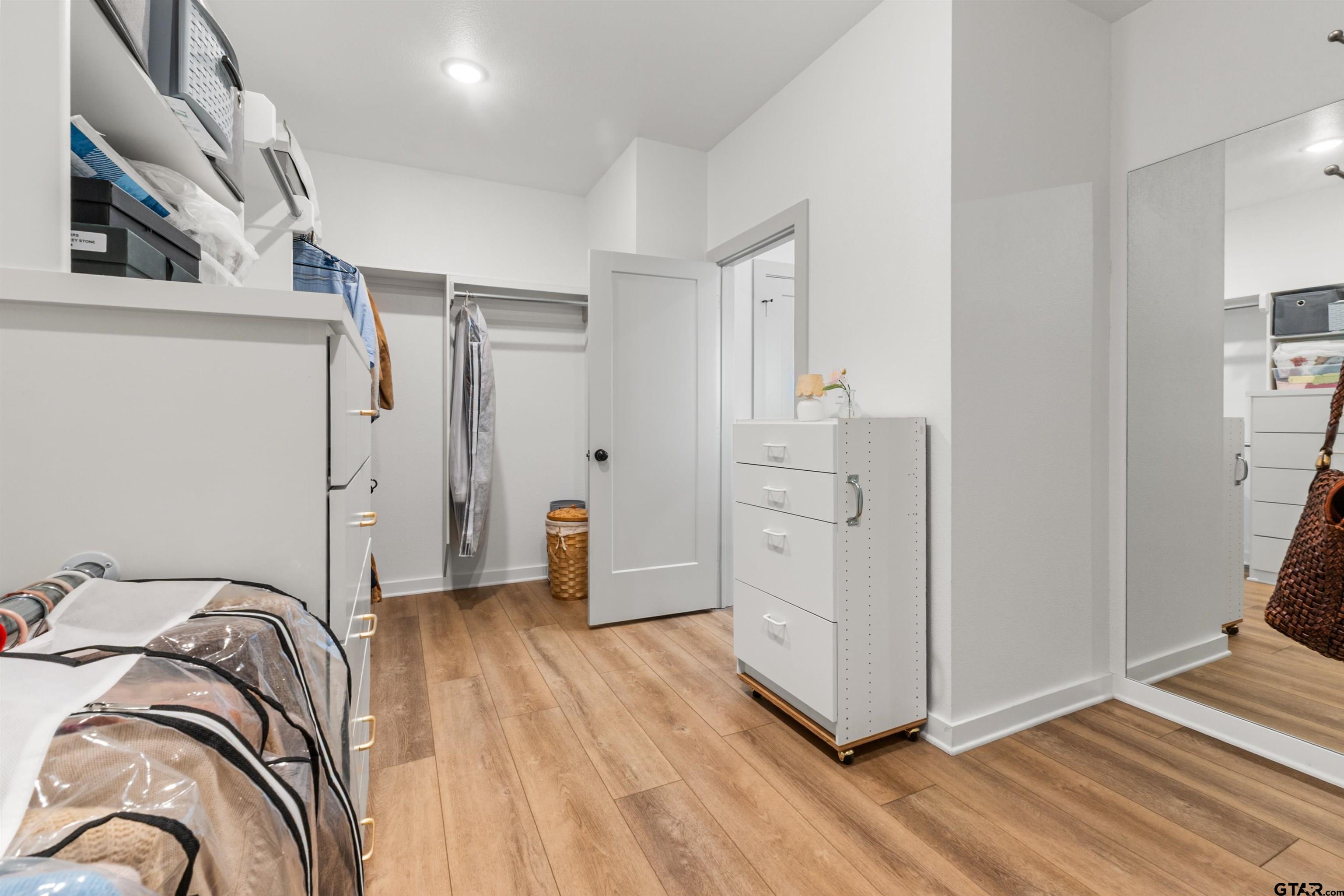 242 Kaul Lane Bullard, TX 75757 - Photo 23 of 45 a view of a bedroom with wooden floor
