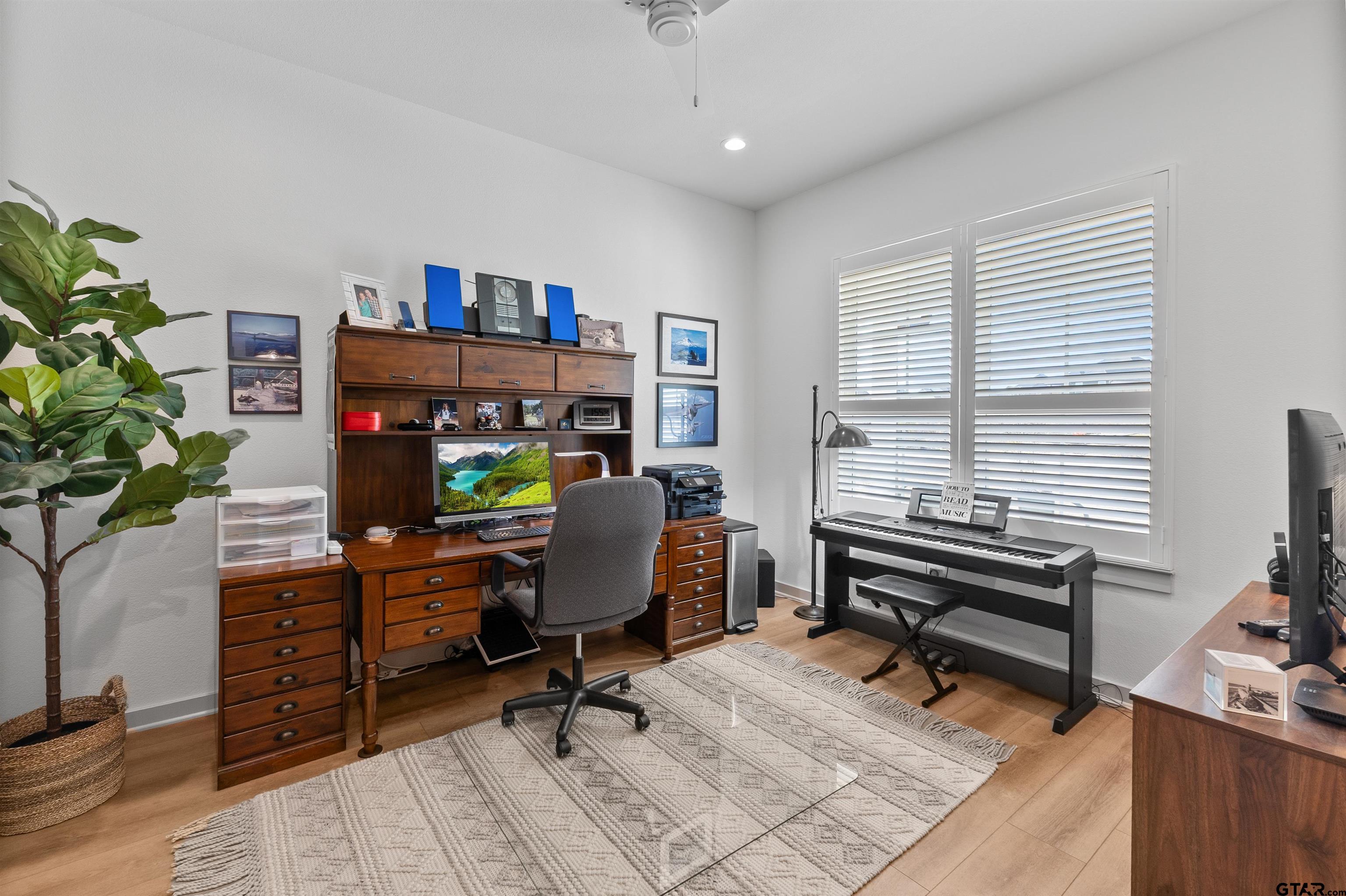 242 Kaul Lane Bullard, TX 75757 - Photo 25 of 45 a view of a workspace with furniture and a window