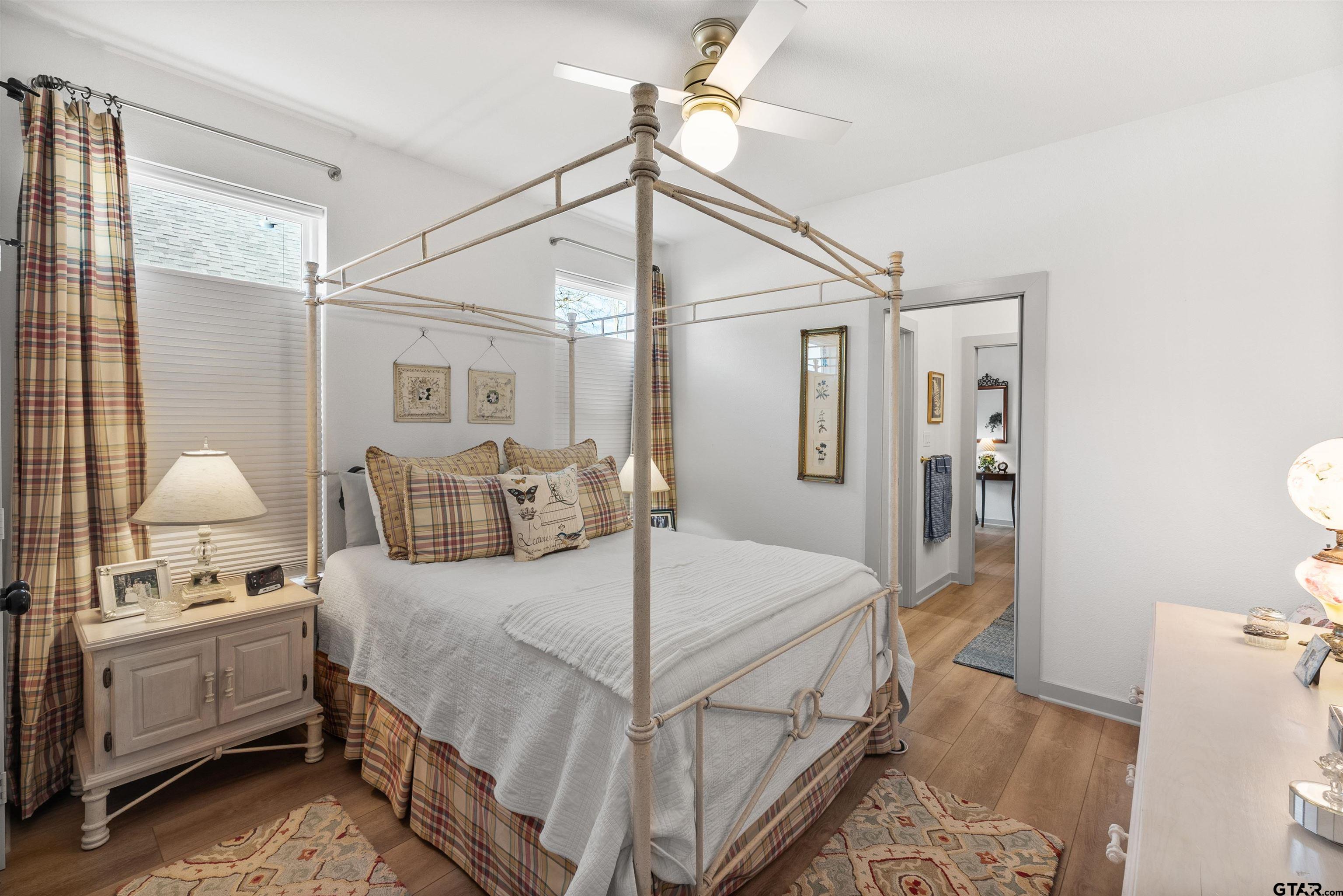 242 Kaul Lane Bullard, TX 75757 - Photo 27 of 45 a bedroom with a bed and a chandelier