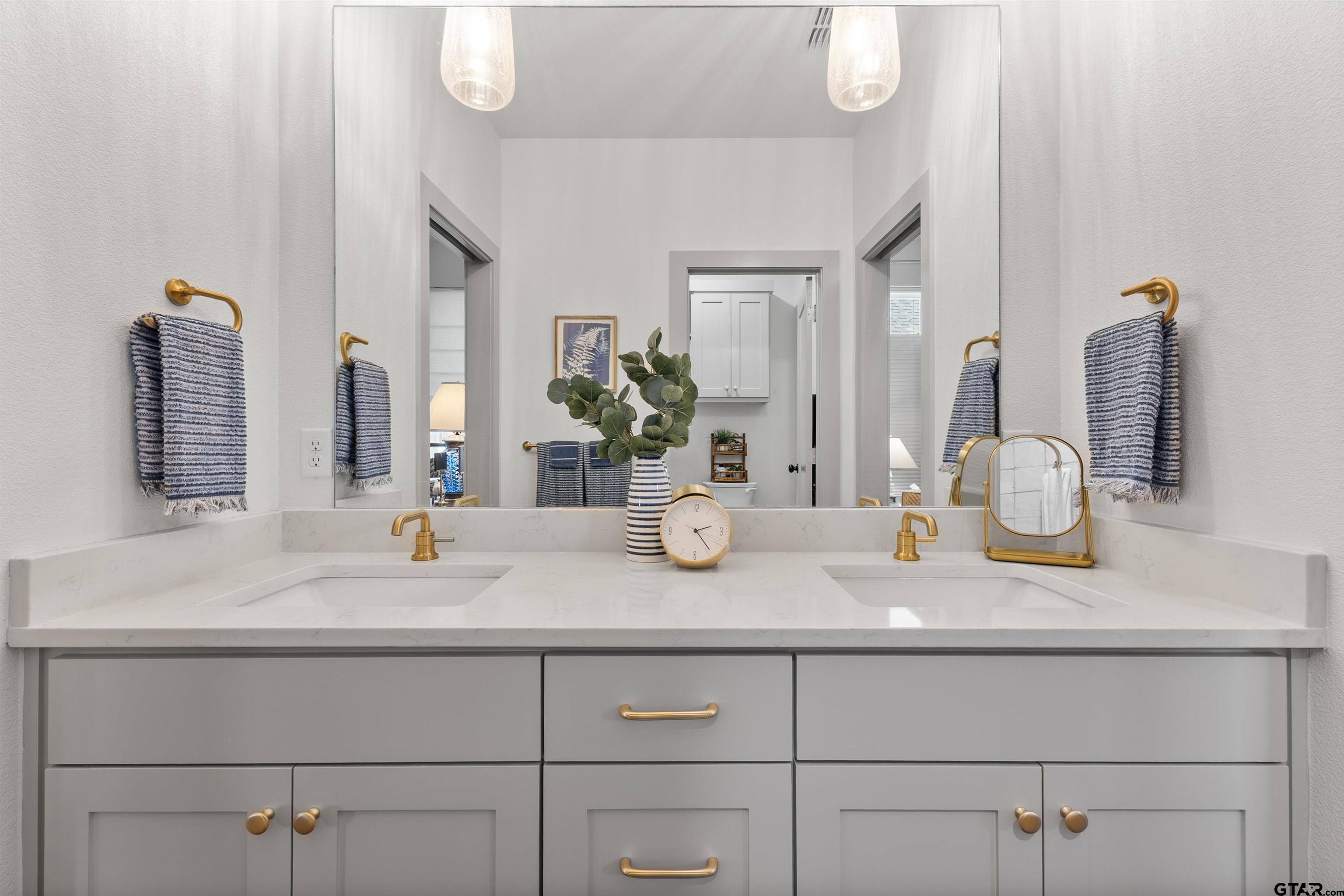 242 Kaul Lane Bullard, TX 75757 - Photo 29 of 45 a bathroom with a sink and a mirror