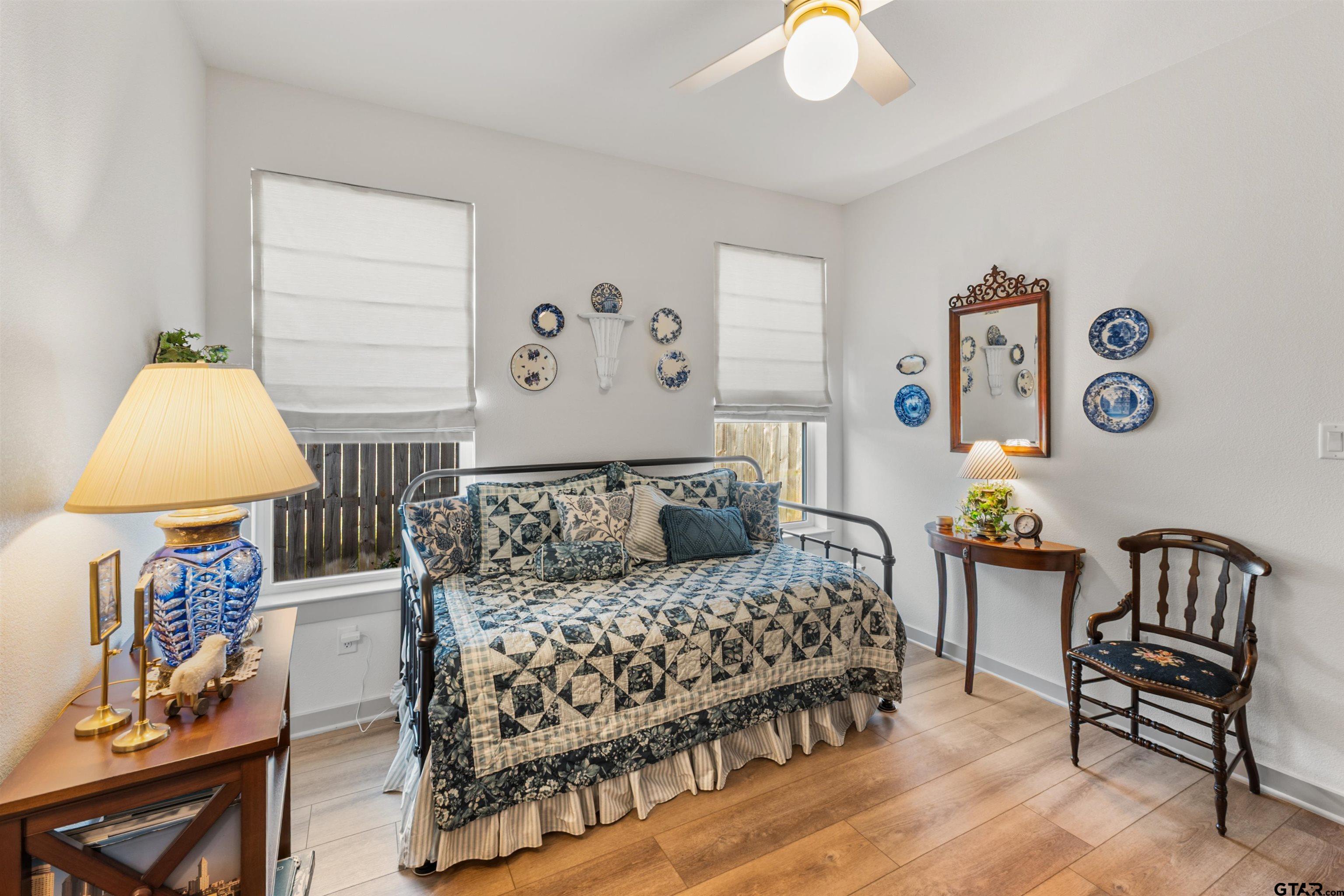 242 Kaul Lane Bullard, TX 75757 - Photo 32 of 45 a bedroom with a bed and a chandelier