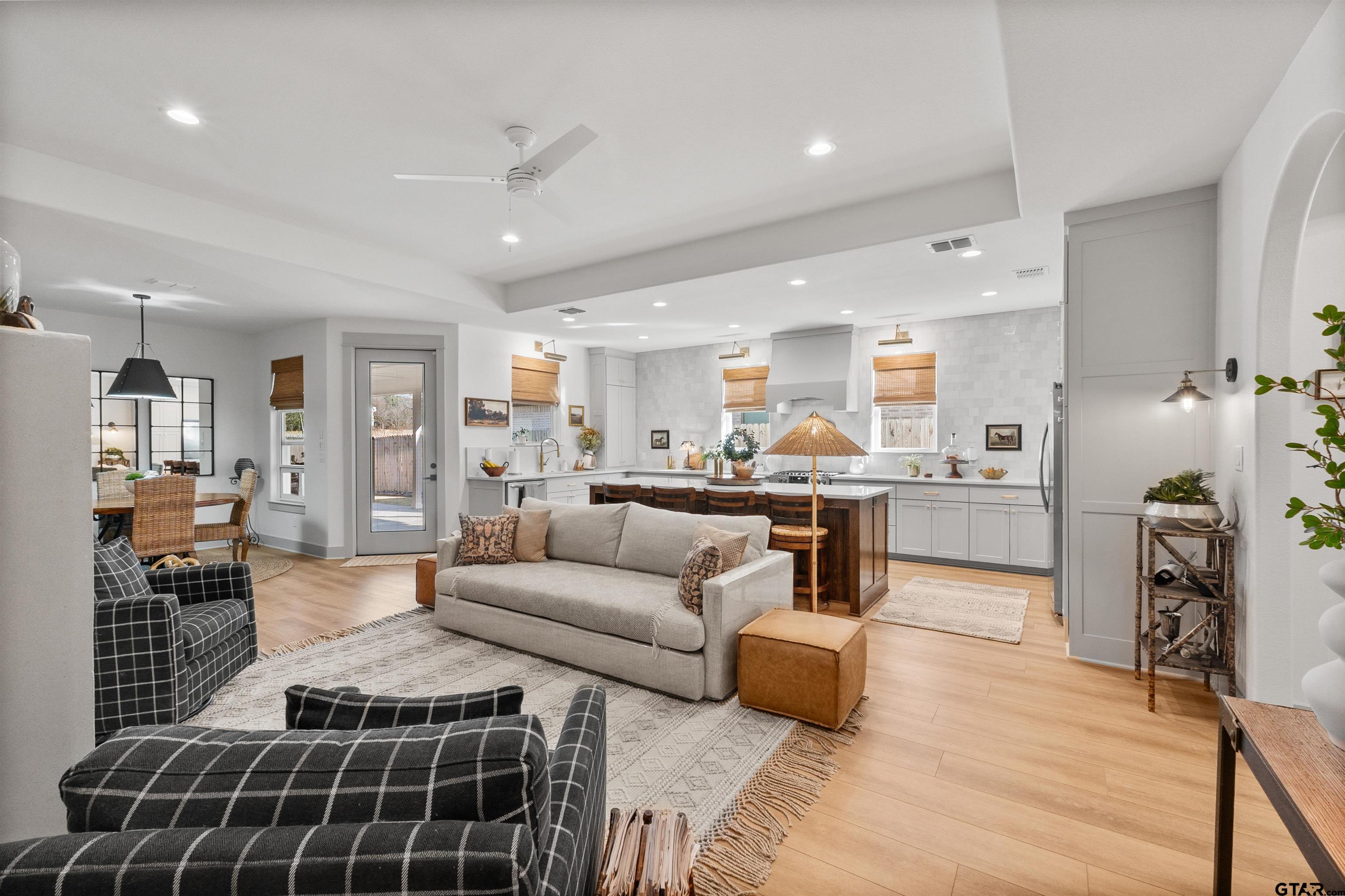 242 Kaul Lane Bullard, TX 75757 - Photo 4 of 45 a living room with furniture a kitchen view and kitchen appliances