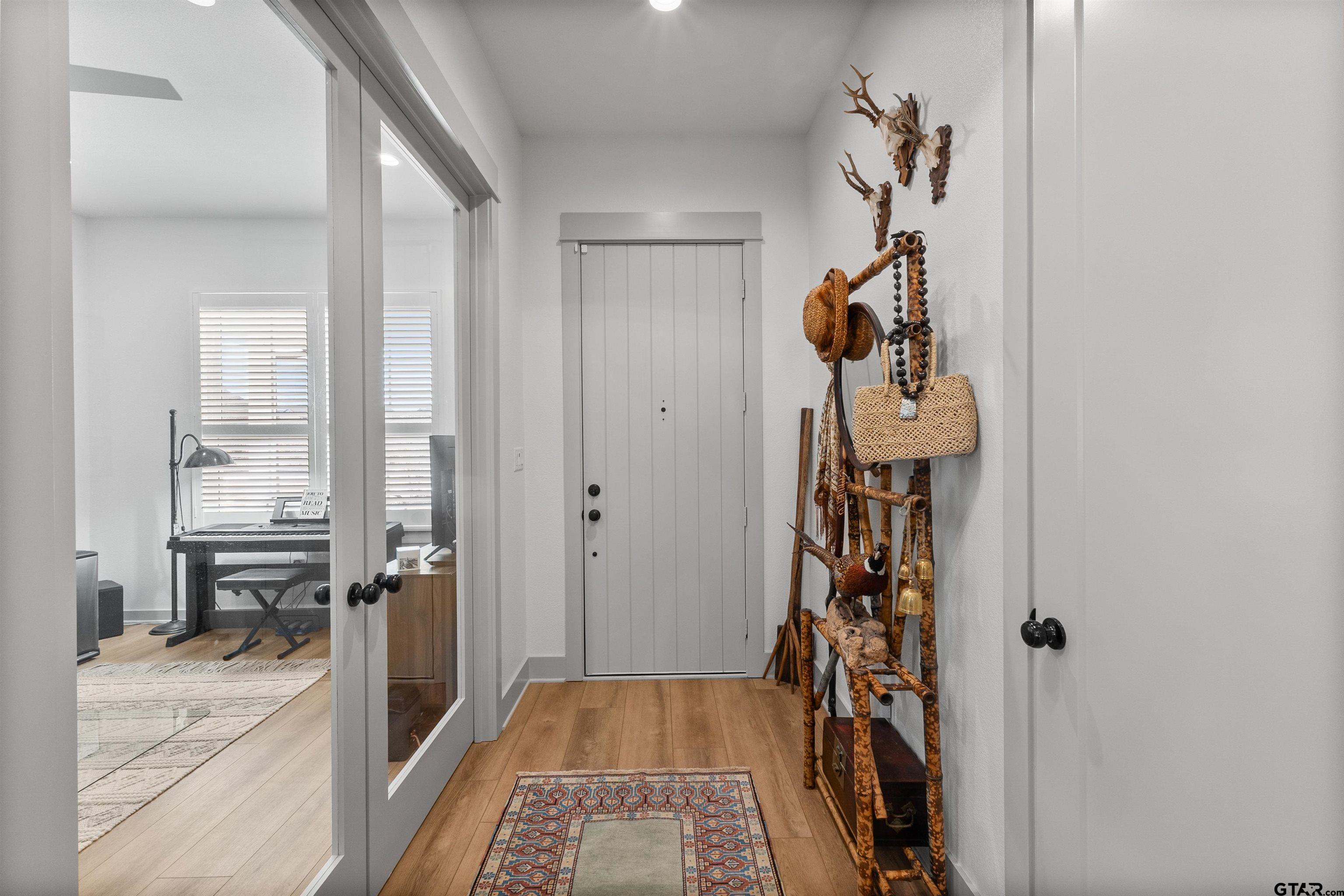 242 Kaul Lane Bullard, TX 75757 - Photo 44 of 45 a view of a hallway and a livingroom with furniture