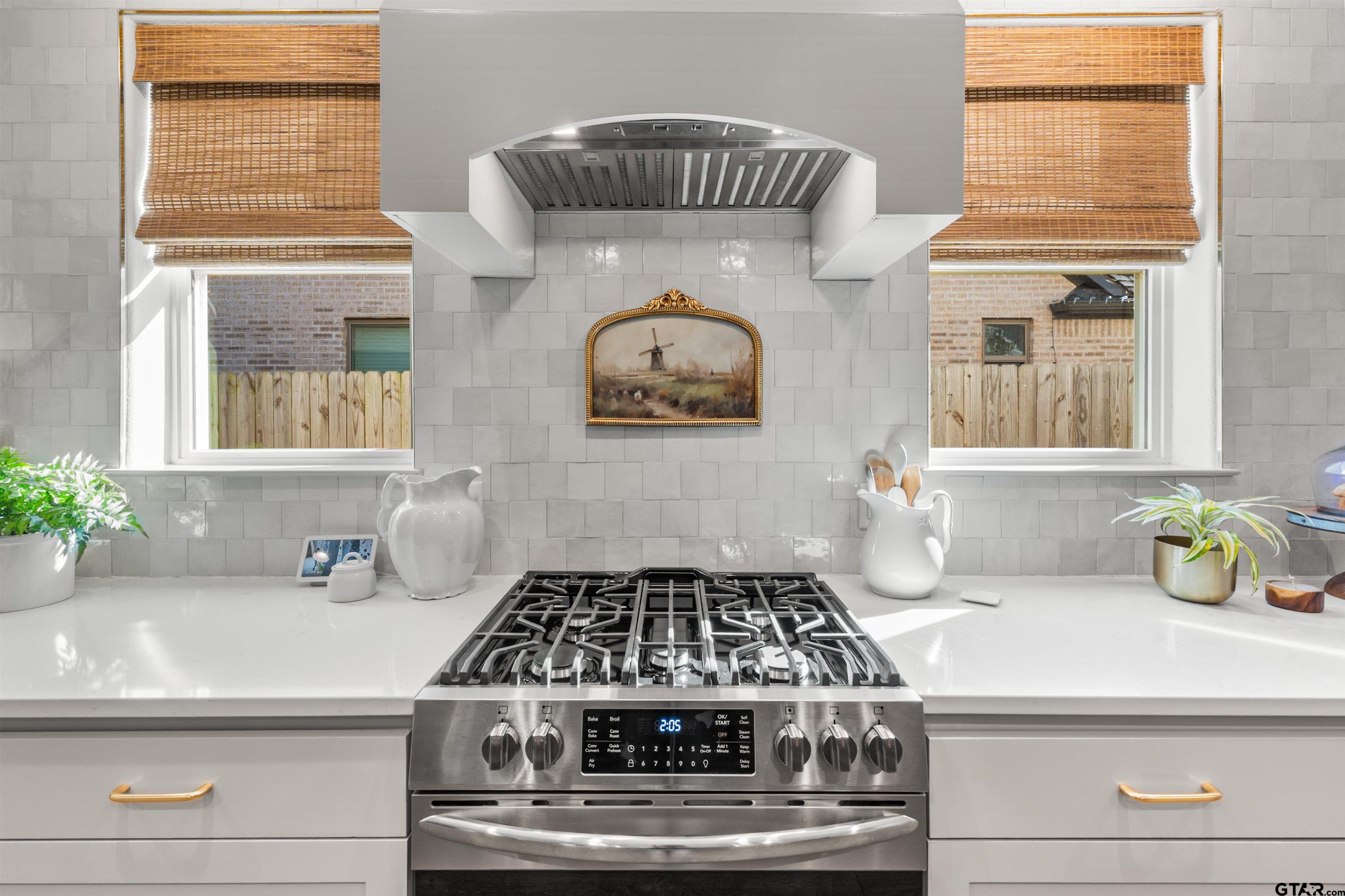 242 Kaul Lane Bullard, TX 75757 - Photo 7 of 45 a kitchen with a stove and a cabinet