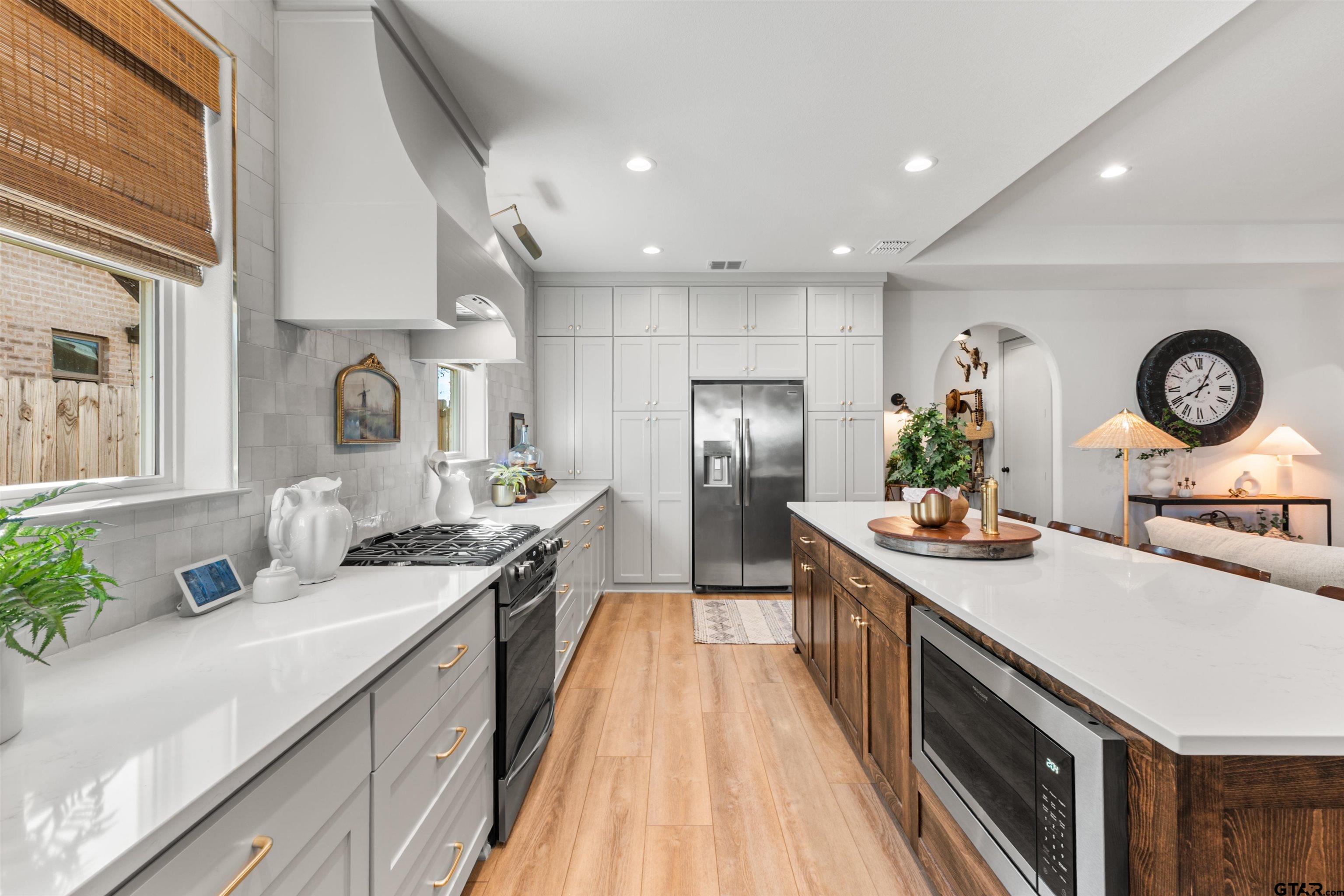 242 Kaul Lane Bullard, TX 75757 - Photo 8 of 45 a kitchen with stainless steel appliances granite countertop a sink stove and refrigerator