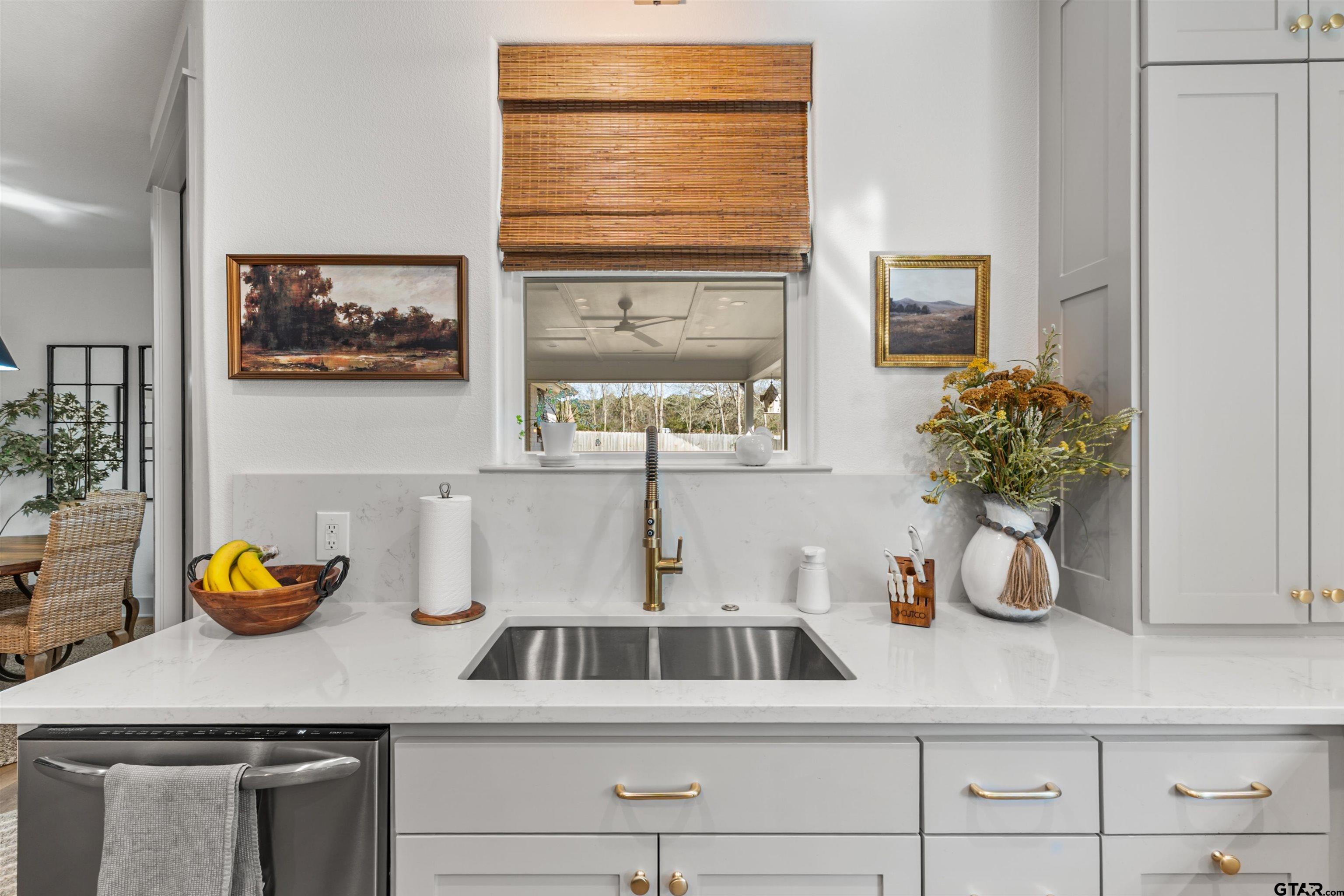 242 Kaul Lane Bullard, TX 75757 - Photo 9 of 45 a kitchen with a sink cabinets and window