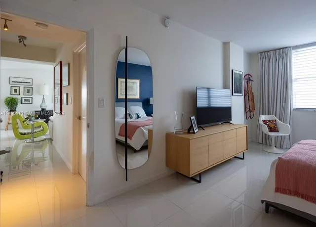 a living room with furniture and a lamp