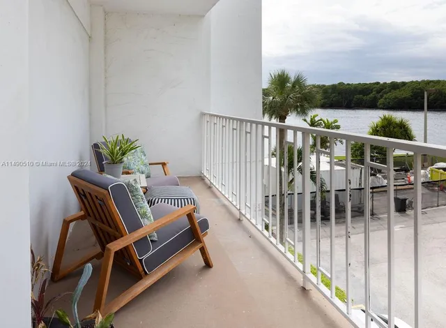 a view of buildings and lake